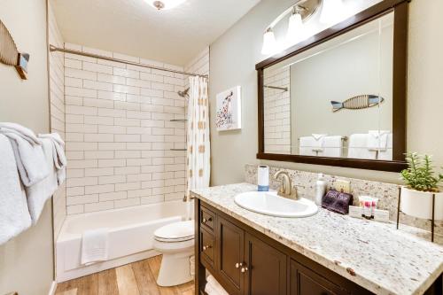 a bathroom with a sink and a toilet and a mirror at Ski Getaway! Mtn-View Condo Near Keystone Resort in Keystone