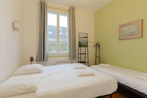 Llit o llits en una habitació de Plage et centre