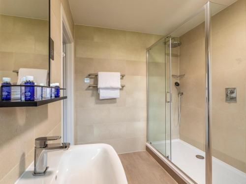 a bathroom with a sink and a shower at 2 Bed in Saltash oc-87705 in St. Mellion