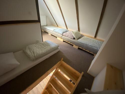 an overhead view of two beds in a room at Chaloupka Jeřmanice in Jeřmanice
