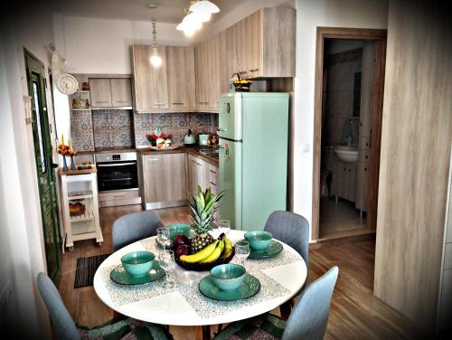 a kitchen with a table with fruit on it at Laurel LK Houses in Kritinia Rhodes in Kritinía