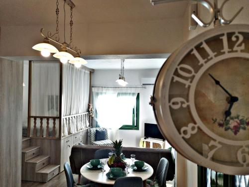 a living room with a table and chairs and a dining room at Laurel LK Houses in Kritinia Rhodes in Kritinía