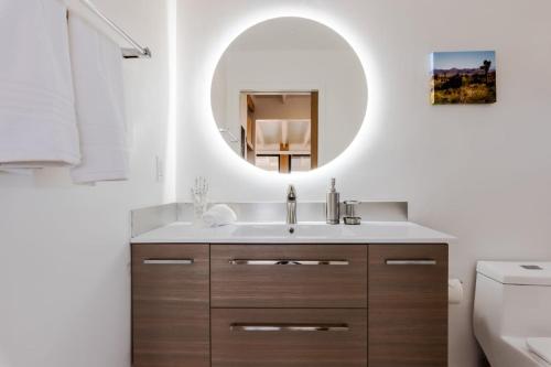 a bathroom with a sink and a mirror at Atomic Ranch by Fieldtrip Secluded Pool Views in Pioneertown