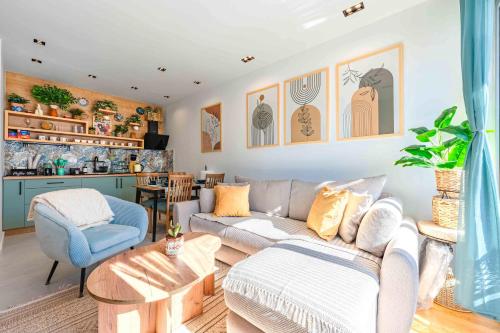 a living room with a couch and a table at Boho Dream Apartments in Ulcinj