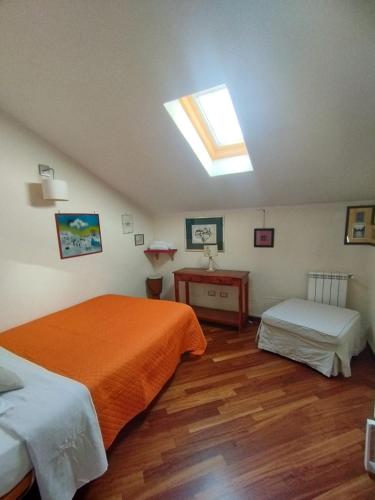 a bedroom with two beds and a skylight at Villa Roverella Sutri Home Sweet Home Viterbo in Sutri