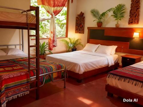 a bedroom with two beds and a bunk bed at Ingaru Lodge in Huamboya