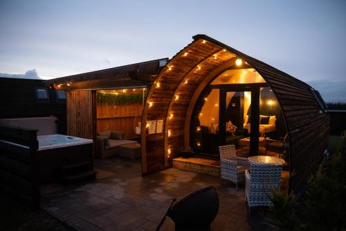 a gazebo with lights on top of it at Wigtown by Wigwam Holidays in Newton Stewart