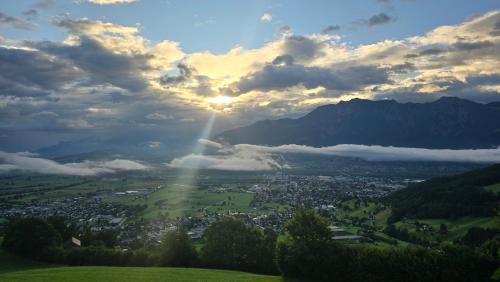 a view of a city from a hill with the sun setting at Nebelmeer Chalet Grabs mit Panorama über das Rheintal in Grabs