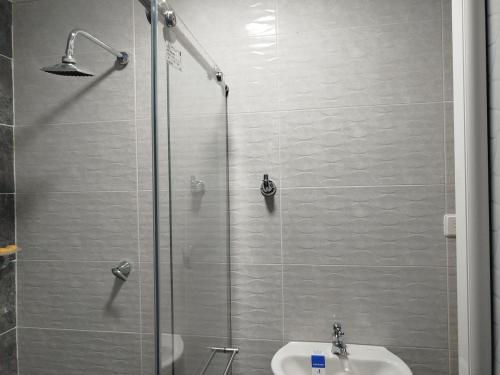 a bathroom with a shower and a sink at Santa Marta 1 in Yopal