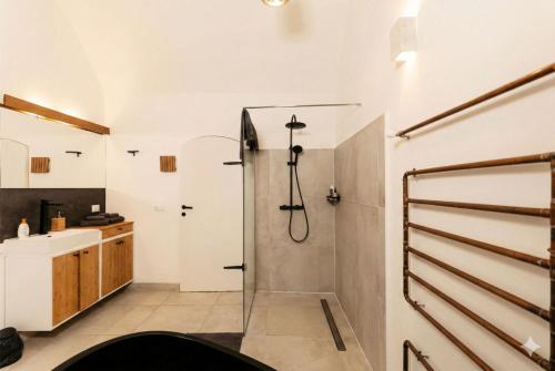 a bathroom with a shower and a sink at L'Arco Trieste studio living 1 in Trieste