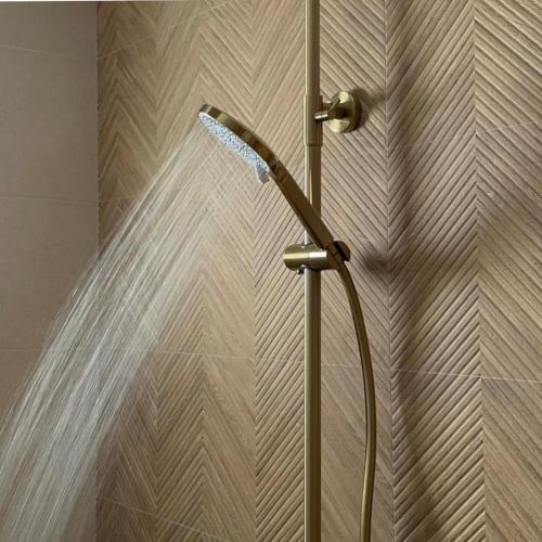 a shower with a shower head in a bathroom at Hs Nieves Centro in Chipiona