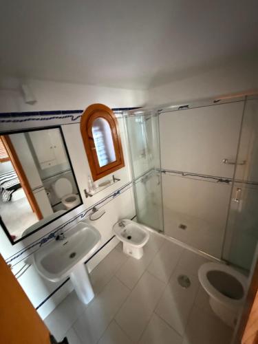 a bathroom with a sink and a toilet at Club aldeas de taray in San Javier