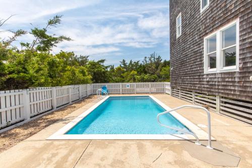 a swimming pool in the backyard of a house at 7219 - C-Waves in Salvo