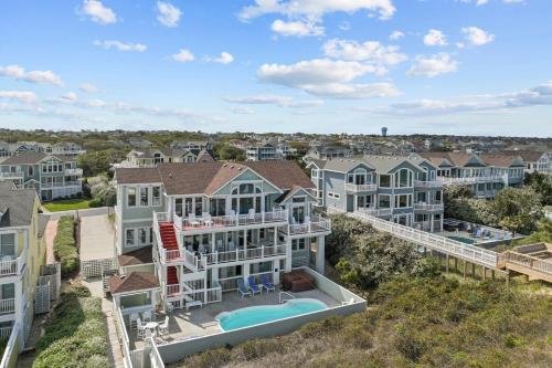 an aerial view of a house with a swimming pool at 4099 - 3-2-1 Relax in Duck