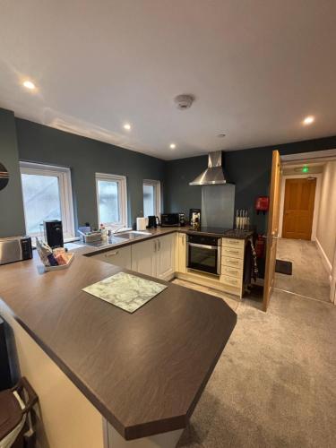 a kitchen with a counter top in a room at Bryn Melyn Apartments in Barmouth
