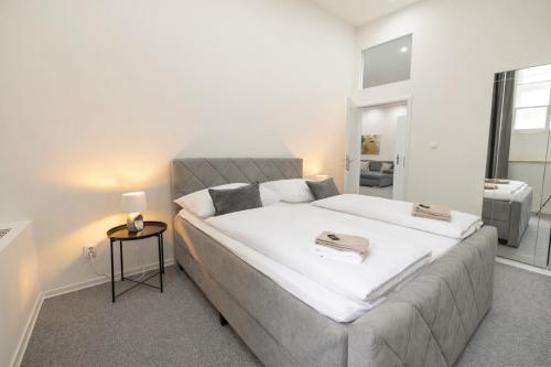 a bedroom with a large bed in a room at Beethoven Suite in Vienna