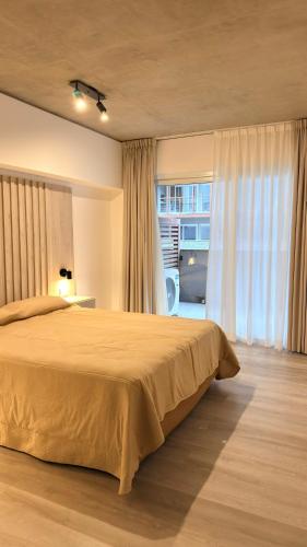 a bedroom with a large bed and a window at Almarena La Reserva UF 11 PB in Costa del Este