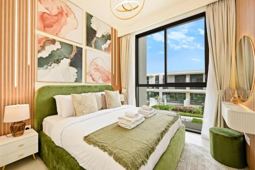 a bedroom with a green bed and a large window at Warm and Cozy 4BR Villa with Pool Access in Dubai