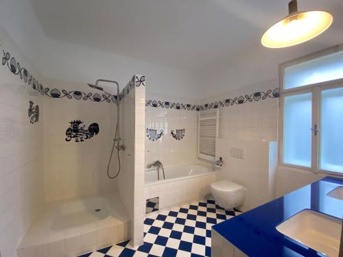 a bathroom with a tub and a toilet and a sink at Wienerwaldhof in Irenental