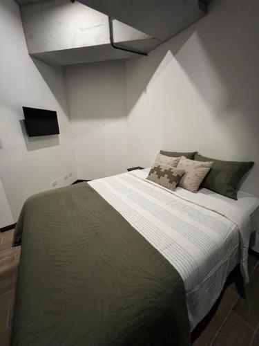 Llit o llits en una habitació de Edificio séptimo