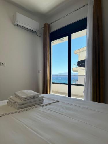 Llit o llits en una habitació de Veya Apartment