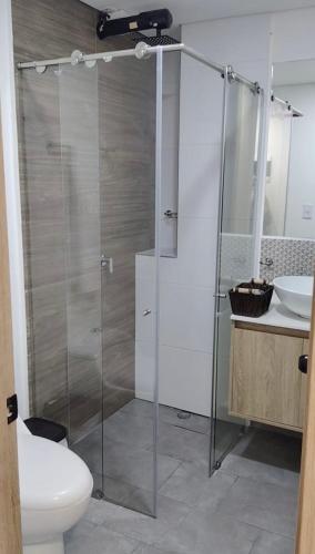 a bathroom with a shower and a toilet and a sink at Estocolmo in Armenia