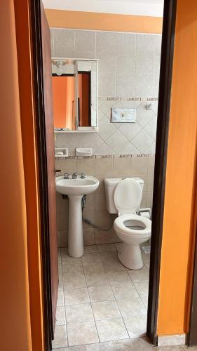 a bathroom with a toilet and a sink at Tu departamento en Formosa in Formosa