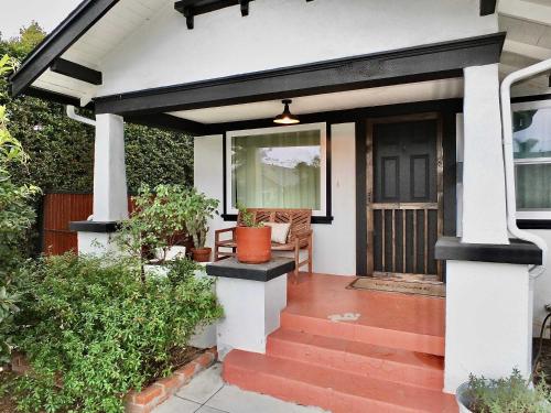 a house with a black and white front porch at Charming Craftsman - Beach Close in Long Beach