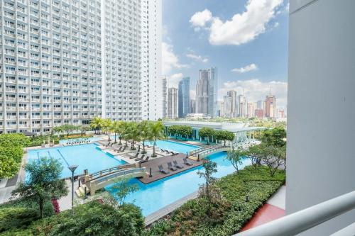 an overhead view of a swimming pool in a building at Modern Stays Makati Pool View Jazz Residences in Manila