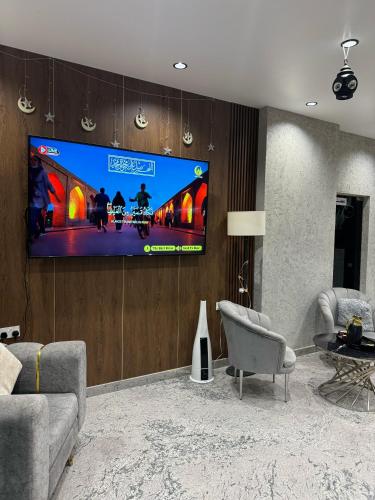 Télévision ou salle de divertissement dans l'établissement Pyramids Hotel