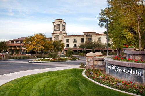 a building with a clock tower in the middle of a road at Hilton Scottsdale Resort & Villas in Scottsdale