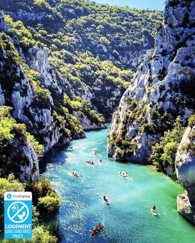 a group of people swimming in a river in a canyon at Camping Verdon familial 3 étoiles - 20 min du lac de Sainte Croix in Esparron-de-Verdon