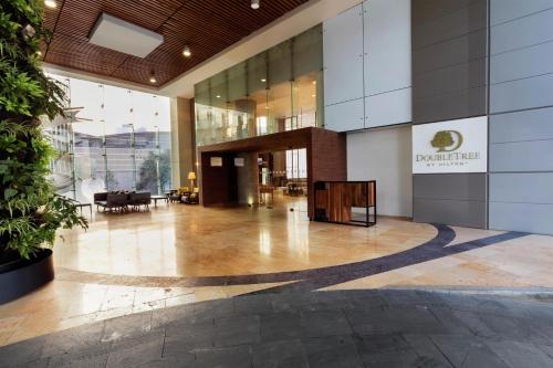 an empty lobby of a building with a sign on it at Doubletree By Hilton Mexico City Santa Fe in Mexico City