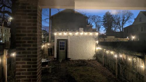 a building with lights on the side of it at night at Rooftop GreeneHouse Suite in Philadelphia