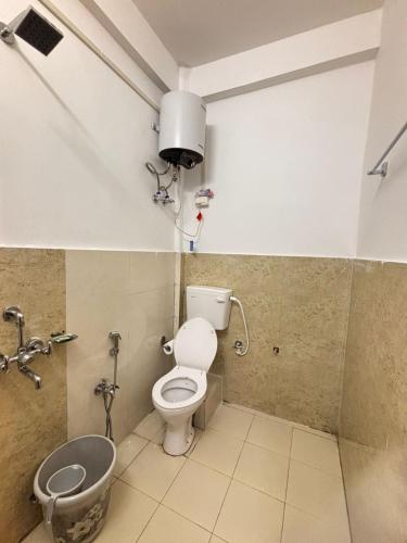 a bathroom with a toilet and a sink at Divine Homestay Dirang in Dirang Dzong