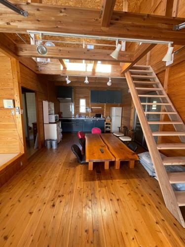 a large room with a wooden table and stairs at Jurakuji - Vacation STAY 15239v in Awa