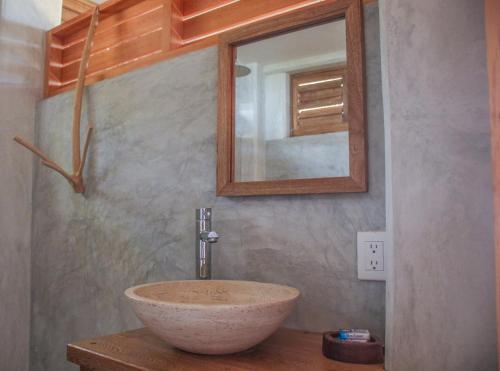 a bathroom with a bowl sink and a mirror at Casa Paraiso Mazunte - Ocean View Lofts - 1 Min Walk to Rinconcito Beach - Fast Wifi Starlink in Mazunte
