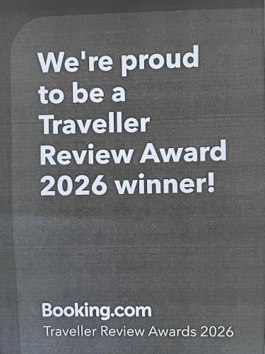 a sign that says were proud to be a travelled review award winner at Bluff House in Saint Leonards