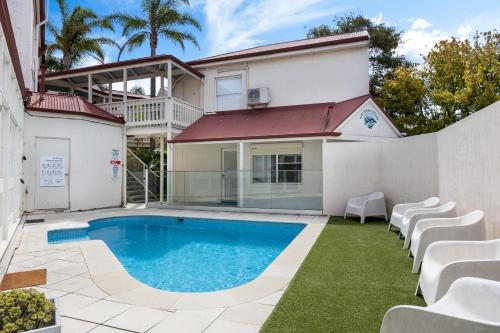 a swimming pool in the backyard of a house at Smugglers Cove - Seaside Comfort near Dining & Shops in Victor Harbor