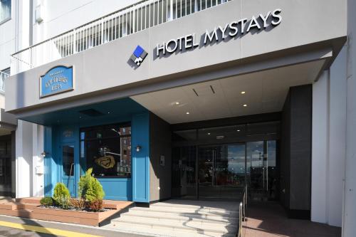 a store front of a building with a sign on it at HOTEL MYSTAYS Hakodate Station in Hakodate