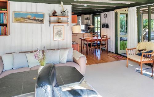 a living room with a couch and a table at Sorbus in Rønne