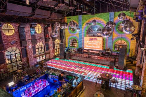 an overhead view of a bar with a colorful wall at GaasBaasCompany, Thamel, Kathmandu in Kathmandu