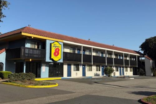 a hotel building with a fast food restaurant at Super 8 by Wyndham Petaluma in Petaluma