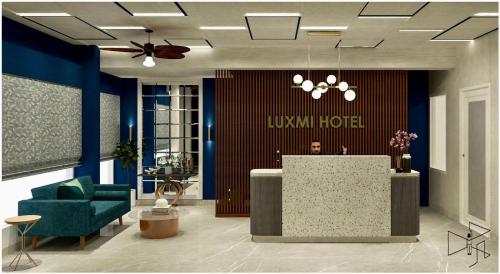 a lobby with a reception desk and a louis m hotel at Luxmi Hotel in Allahābād