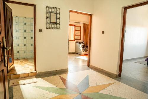 a hallway with a room with a star on the floor at Appartement City Center in Ouarzazate