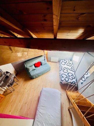 an overhead view of a living room on a boat at Comme à la maison à la montagne in Briançon