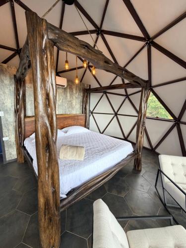 a bedroom with a bed in a tent at Domo Alto del Monte in Alto del Monte