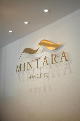 a sign for a niagara new hotel at Mintara Hotel - โรงแรมมินธารา มีนบุรี in Min Buri