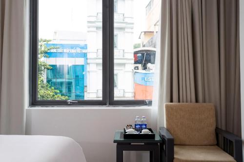 Ένα ή περισσότερα κρεβάτια σε δωμάτιο στο Calista Sai Gon Hotel