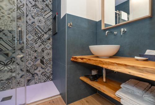 a bathroom with a sink and a shower at Terrazza Campailla in Modica